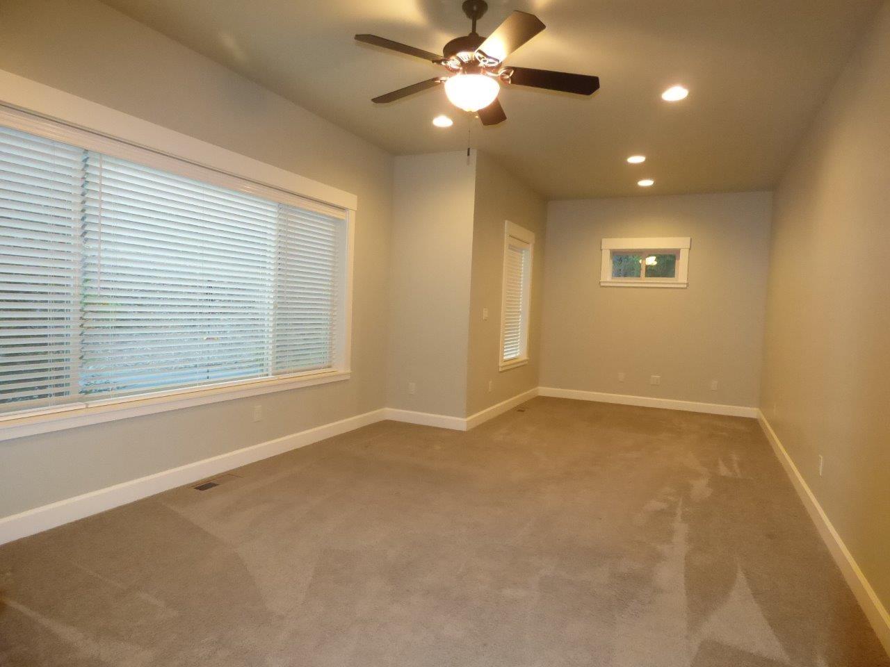 2144 Southwest Allen Creek Road Grants Pass, OR 97527 - Photo 21 of 55 Family/Bonus or could be formal dining room downstairs has double doors and windows for natural light.