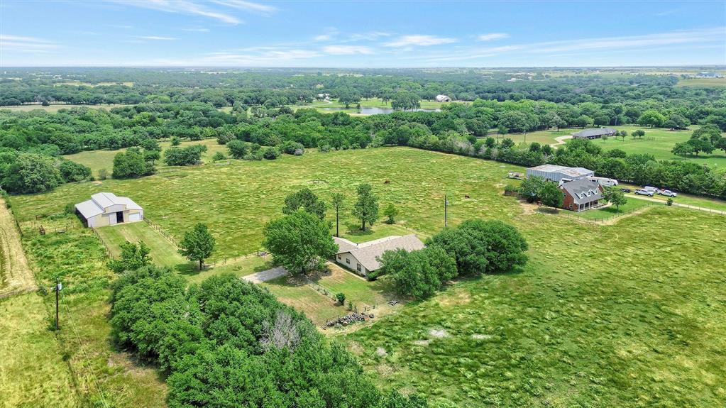 12153 Mustang Road Pilot Point, TX 76258 - Photo 12 of 23 a view of a city with lush green forest