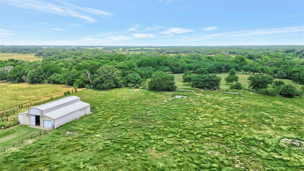 12153 Mustang Road Pilot Point, TX 76258 - Photo 14 of 23 a view of a garden with lawn chairs