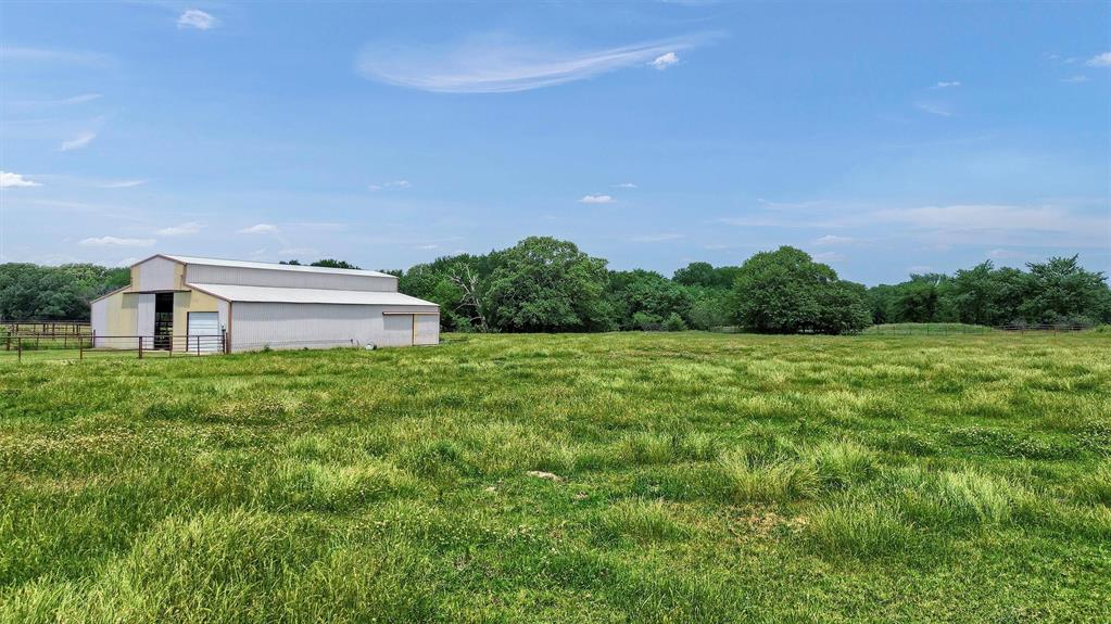 12153 Mustang Road Pilot Point, TX 76258 - Photo 15 of 23 a view of a house with a yard