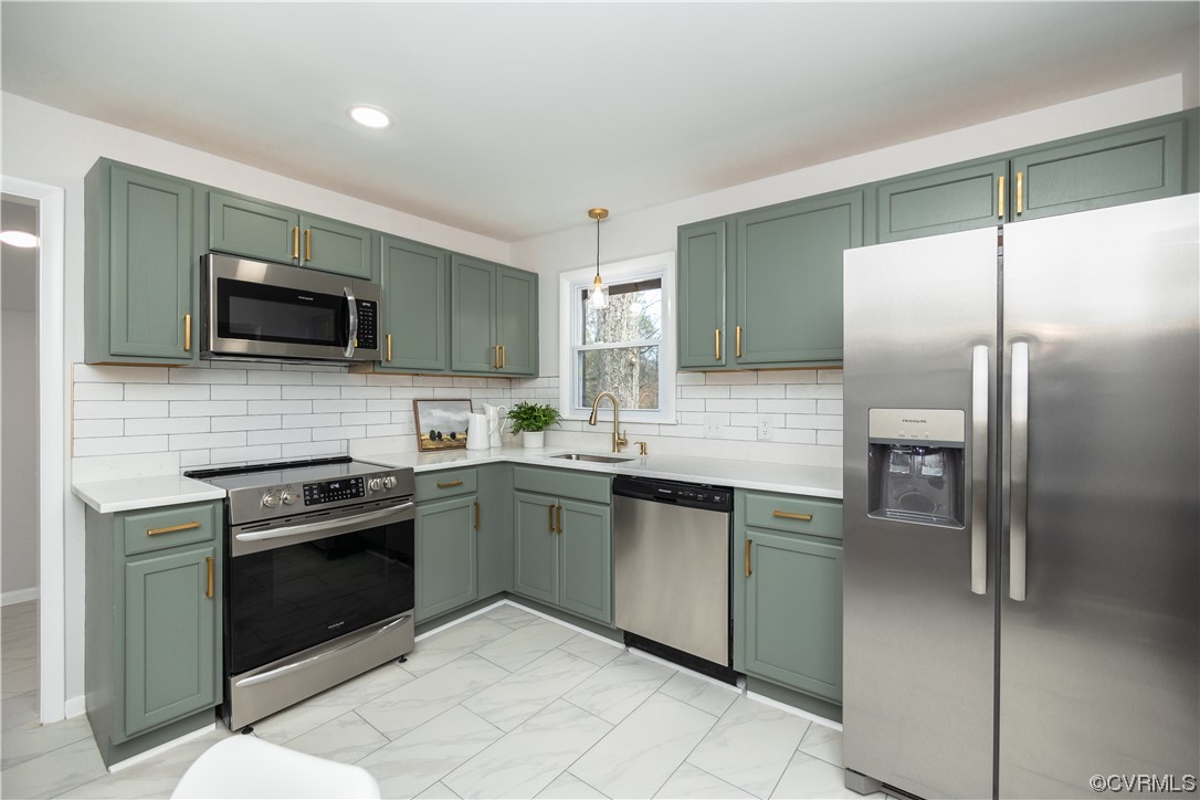 7714 Cherokee Road Richmond, VA 23225 - Photo 13 of 48 a kitchen with granite countertop a refrigerator and a stove top oven