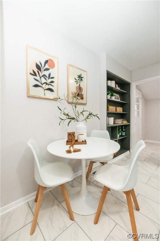 7714 Cherokee Road Richmond, VA 23225 - Photo 18 of 48 a view of a dining room with furniture