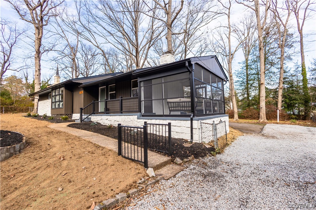 7714 Cherokee Road Richmond, VA 23225 - Photo 2 of 48 a front view of a house with a yard covered in snow