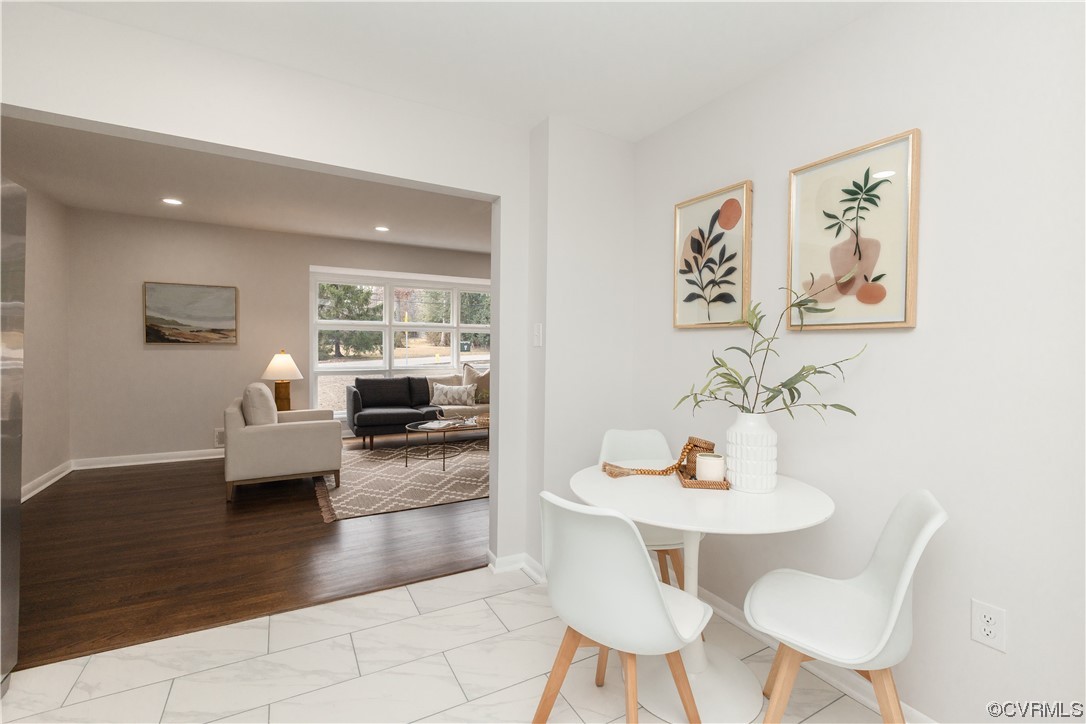 7714 Cherokee Road Richmond, VA 23225 - Photo 21 of 48 a view of a dining room with furniture and wooden floor