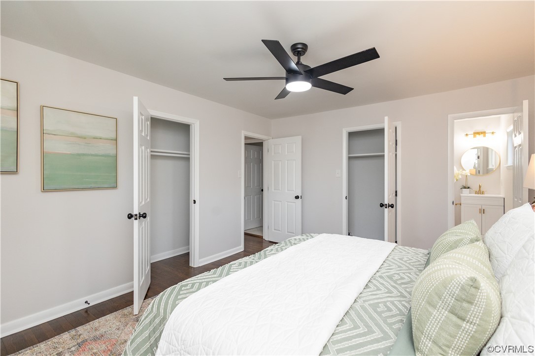 7714 Cherokee Road Richmond, VA 23225 - Photo 27 of 48 a bedroom with a large bed and a chandelier