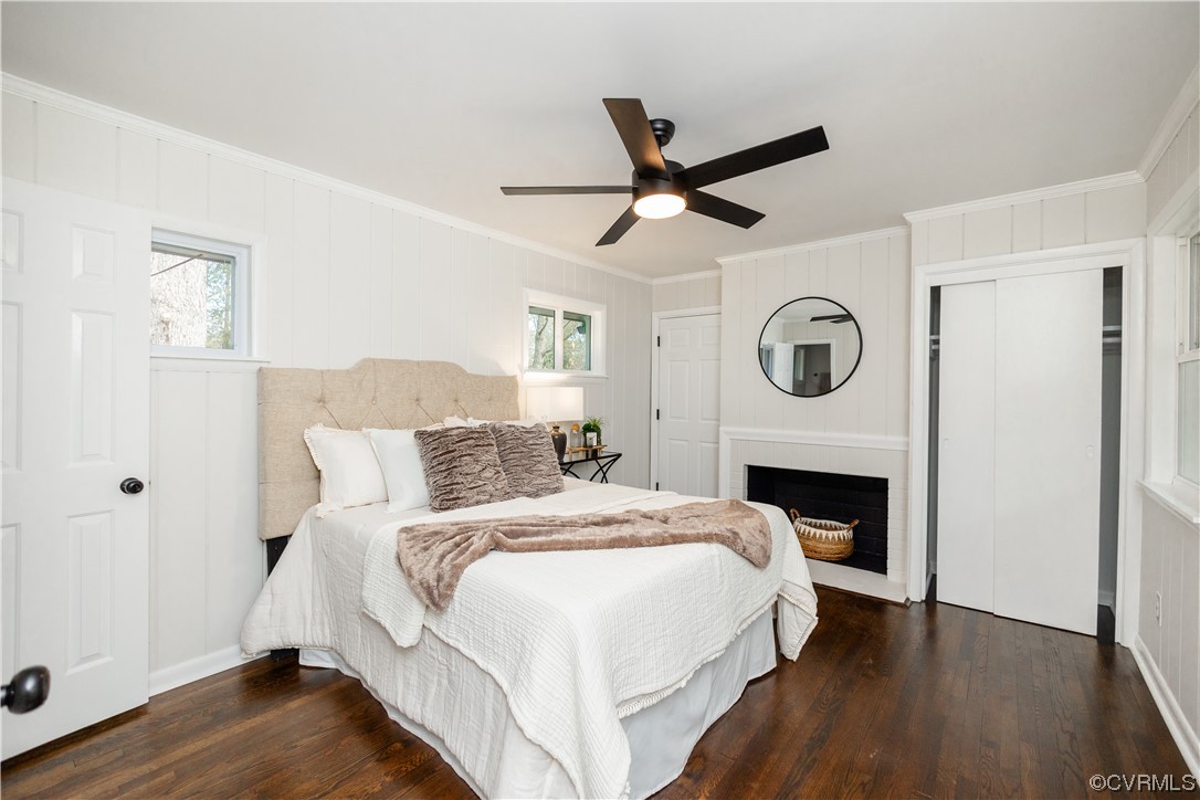 7714 Cherokee Road Richmond, VA 23225 - Photo 33 of 48 a bed room with a bed a fireplace and a clock