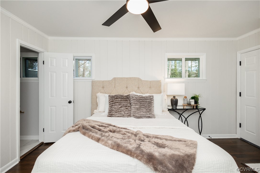 7714 Cherokee Road Richmond, VA 23225 - Photo 34 of 48 a bedroom with a bed and wooden floor