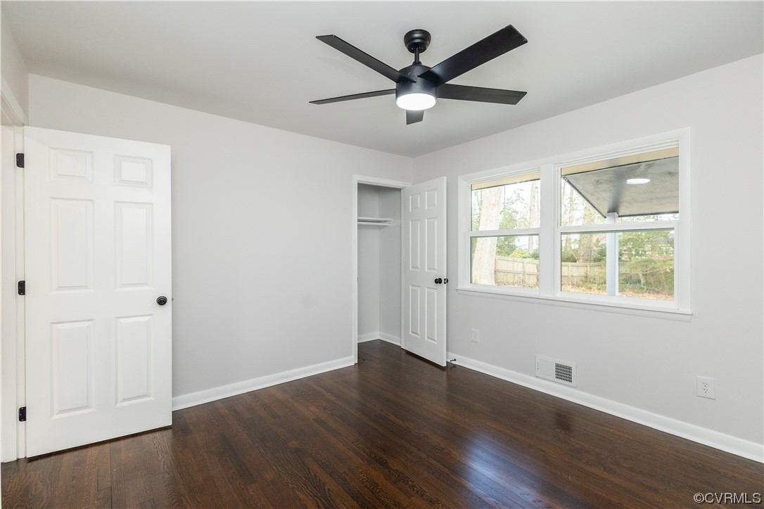 7714 Cherokee Road Richmond, VA 23225 - Photo 37 of 48 an empty room with wooden floor and windows
