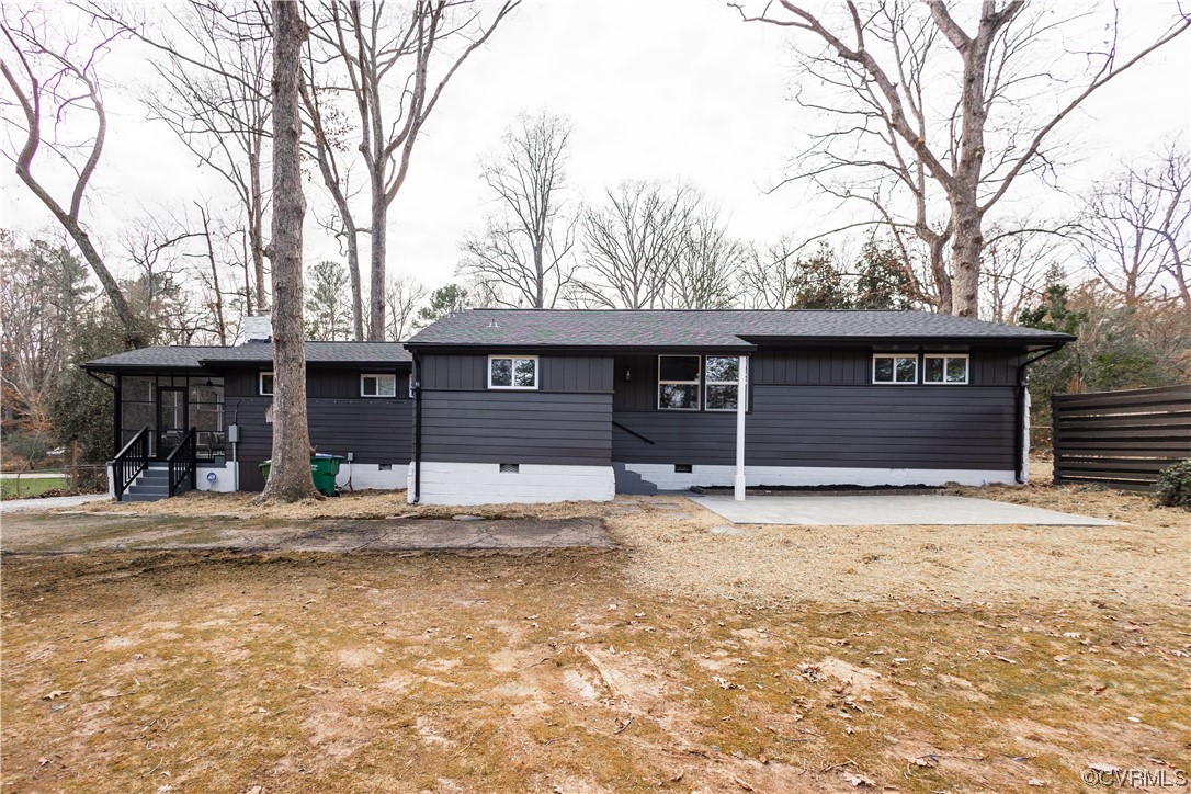 7714 Cherokee Road Richmond, VA 23225 - Photo 39 of 48 a house with trees in front of it