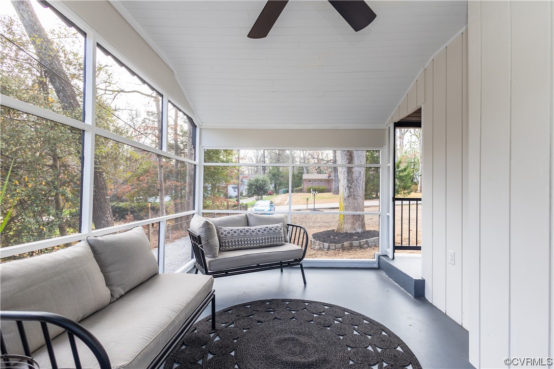 7714 Cherokee Road Richmond, VA 23225 - Photo 46 of 48 a living room with furniture and a floor to ceiling window