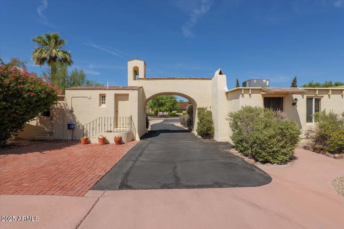 a view of a parking space in front of a house