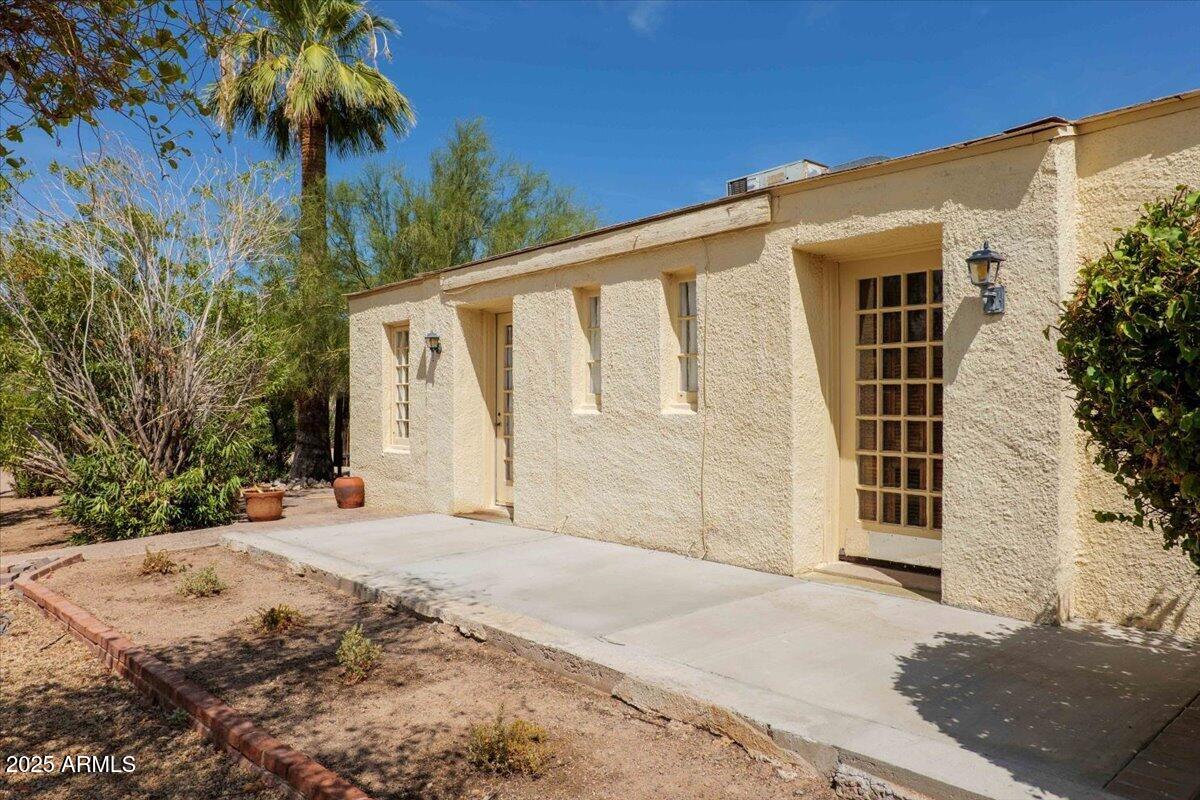 5702 East Camelback Road, Unit MEXICAN Phoenix, AZ 85251 - Photo 21 of 45 a front view of a house with a yard