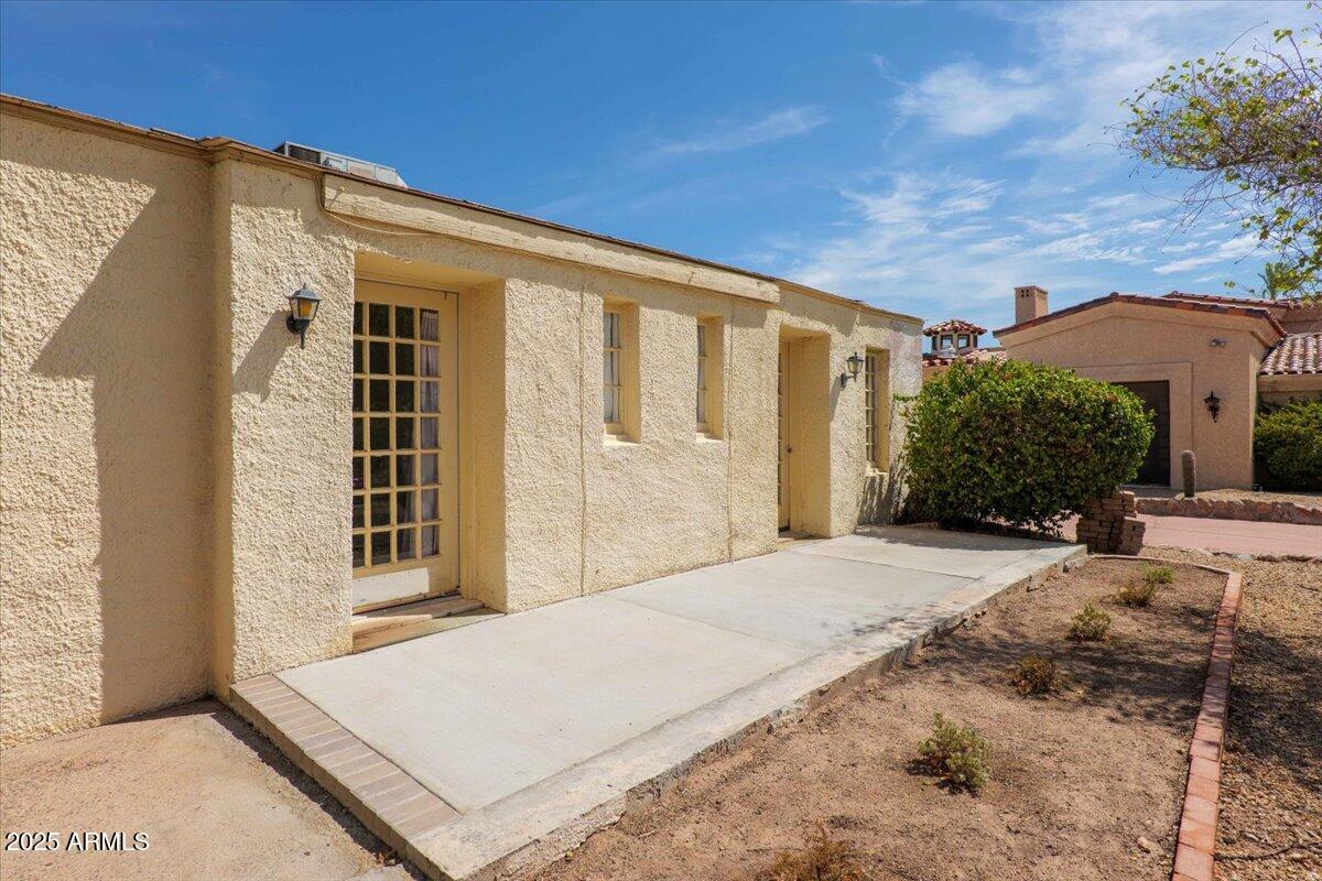 5702 East Camelback Road, Unit MEXICAN Phoenix, AZ 85251 - Photo 22 of 45 a front view of a house with a yard