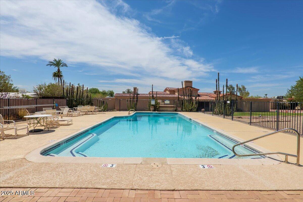 5702 East Camelback Road, Unit MEXICAN Phoenix, AZ 85251 - Photo 24 of 45 a view of a swimming pool with an outdoor seating