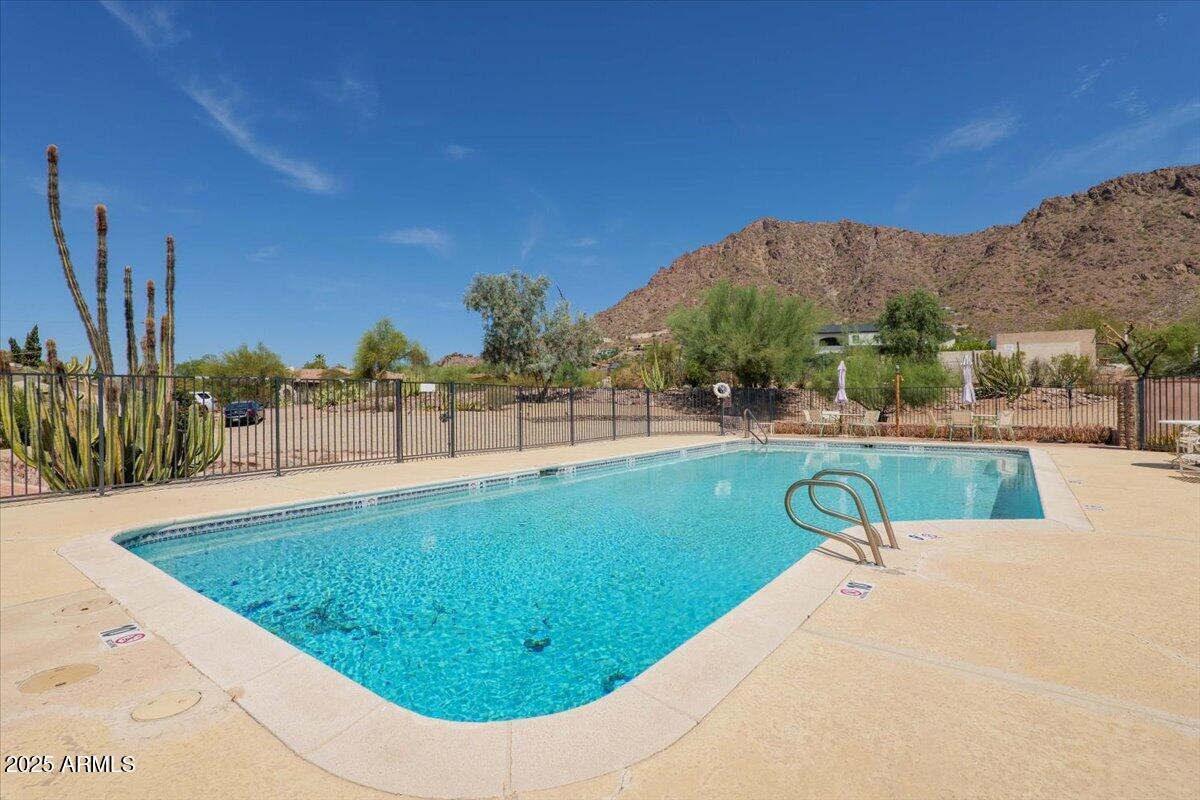 5702 East Camelback Road, Unit MEXICAN Phoenix, AZ 85251 - Photo 25 of 45 a view of a swimming pool with a lake