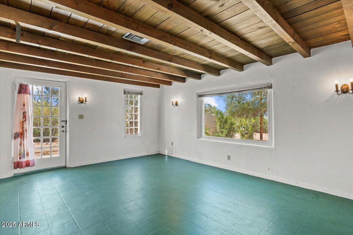 5702 East Camelback Road, Unit MEXICAN Phoenix, AZ 85251 - Photo 4 of 45 a view of an empty room with wooden floor and a window