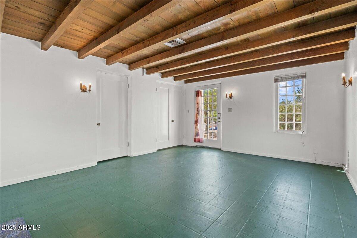5702 East Camelback Road, Unit MEXICAN Phoenix, AZ 85251 - Photo 5 of 45 a view of an empty room with wooden floor and a window