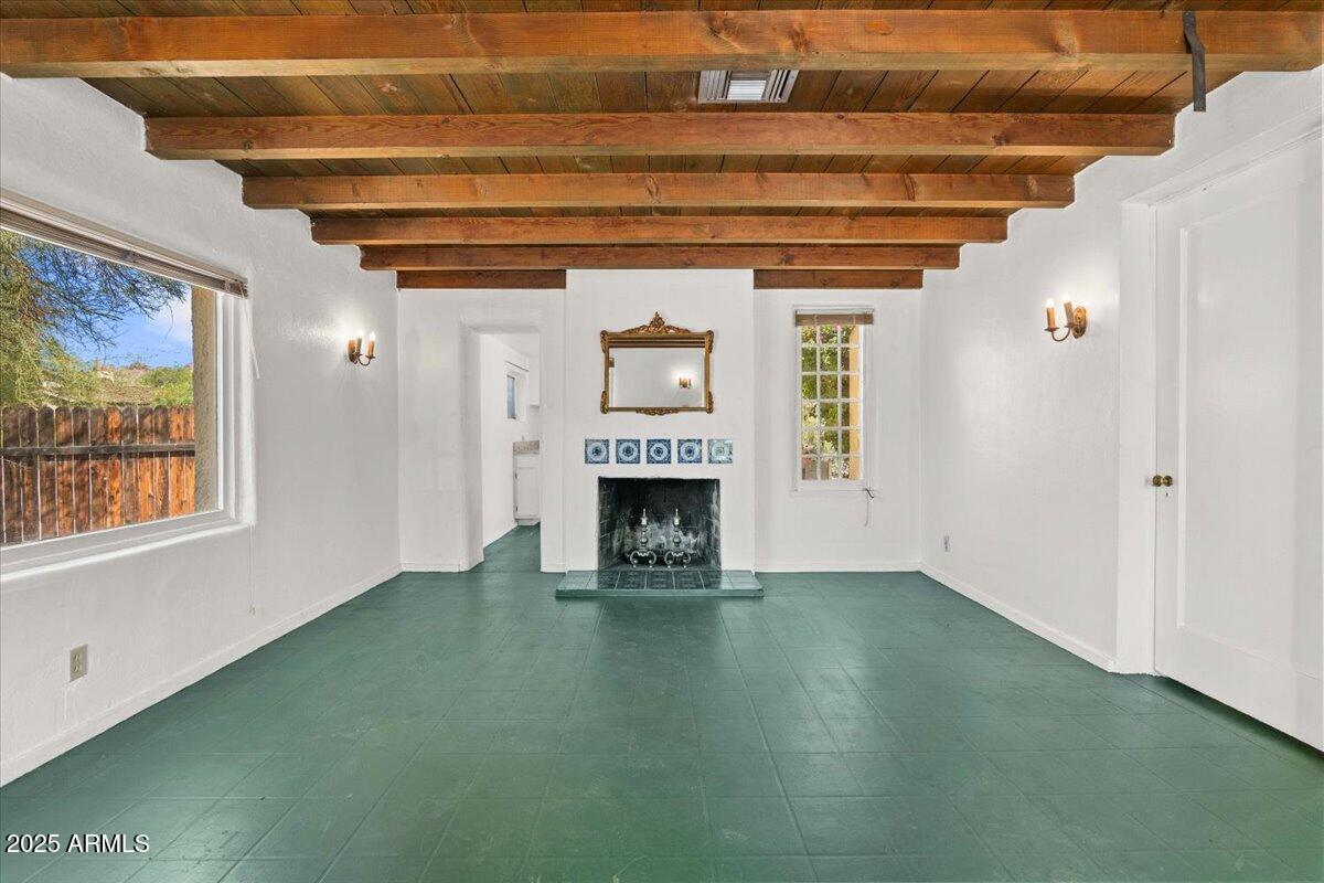 5702 East Camelback Road, Unit MEXICAN Phoenix, AZ 85251 - Photo 7 of 45 a view of an empty room with a fireplace and a window