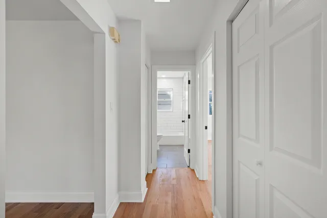 a view of a bathroom from a hallway