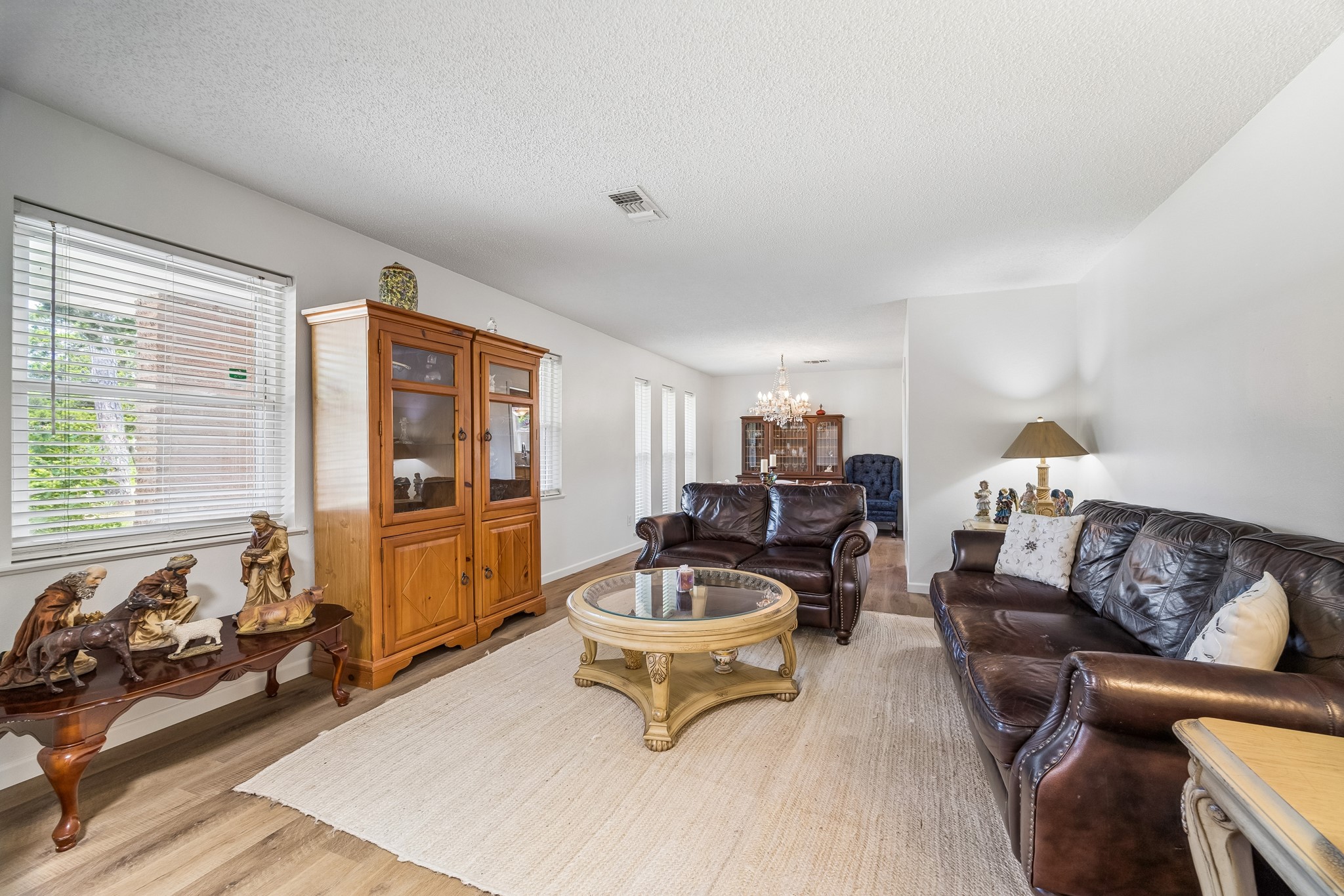 413 Mebane Lane Rosenberg, TX 77471 - Photo 12 of 30 This inviting formal living room features natural light from large windows, elegant flooring and large windows. It is the perfect place to read a book or to enjoy the outside scenery from inside the home.