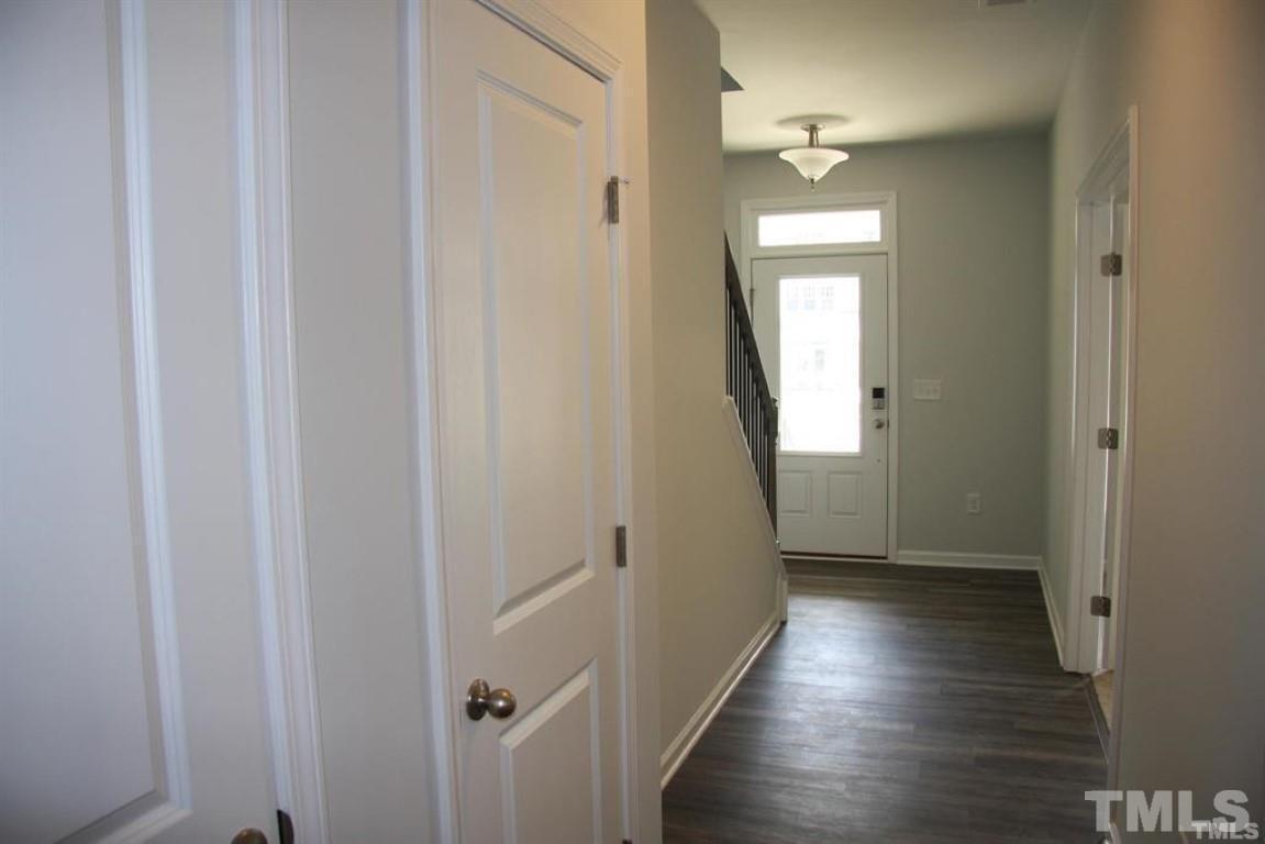 2919 Sunflower Road Apex, NC 27502 - Photo 5 of 34 a view of a hallway with wooden floor