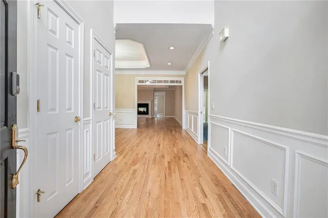 a view of a hallway with wooden floor