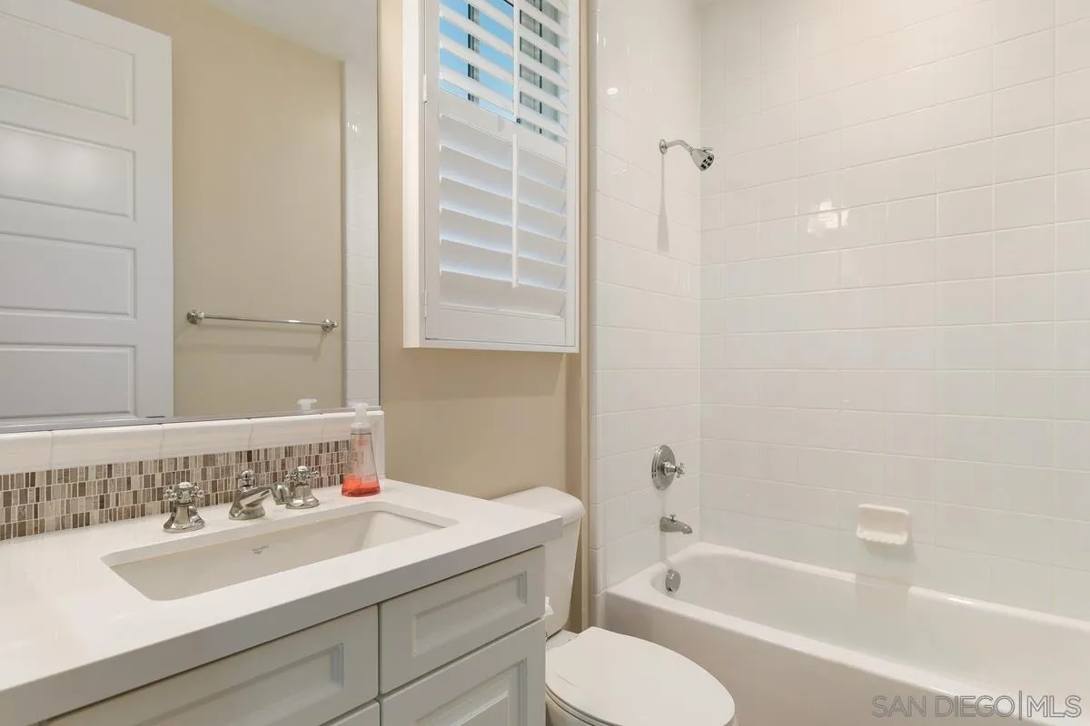 7923 Silvery Moon Lane Rancho Santa Fe, CA 92067 - Photo 11 of 22 a bathroom with a granite countertop sink toilet and shower