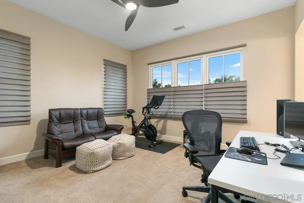 7923 Silvery Moon Lane Rancho Santa Fe, CA 92067 - Photo 19 of 22 a livingroom with workspace and a couch