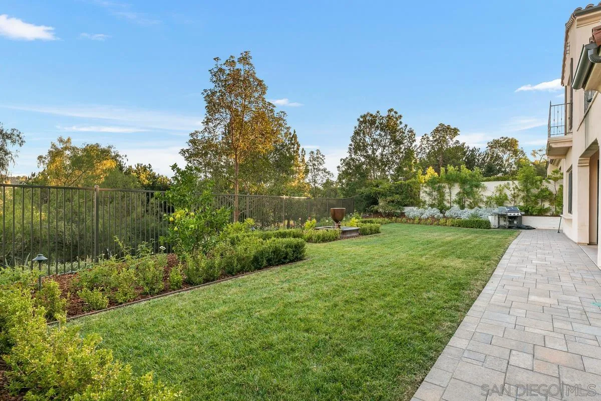 7923 Silvery Moon Lane Rancho Santa Fe, CA 92067 - Photo 20 of 22 a view of a garden with a fountain