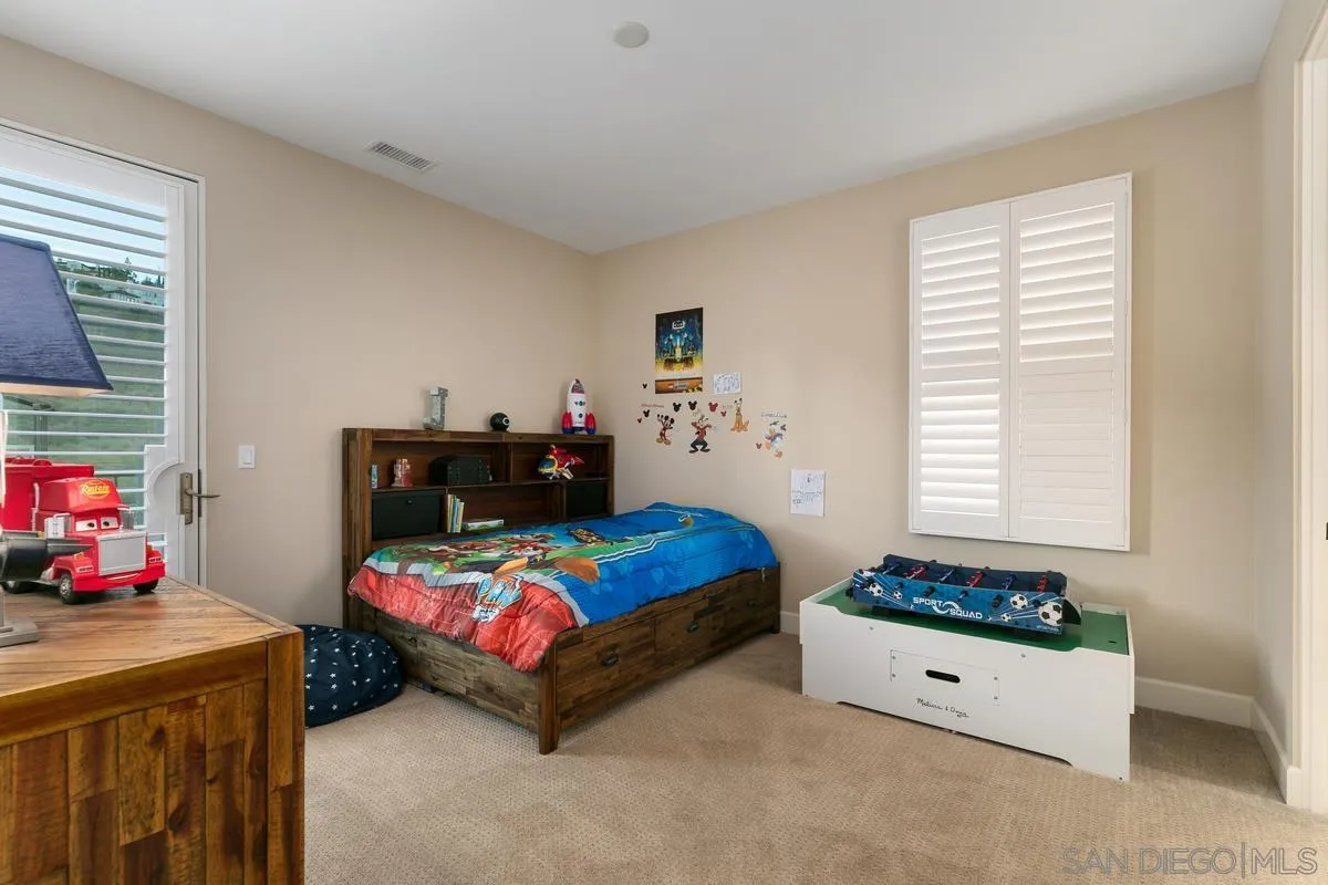 7923 Silvery Moon Lane Rancho Santa Fe, CA 92067 - Photo 10 of 22 a bedroom with a bed and a window
