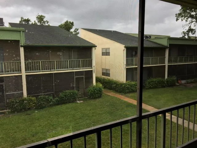 a view of a garden from a balcony