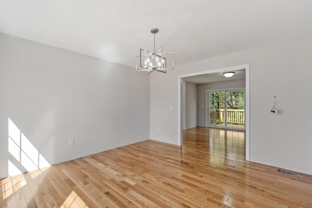 22 Benoit Avenue Pelham, NH 03076 - Photo 22 of 42 a view of a room with wooden floor and large window