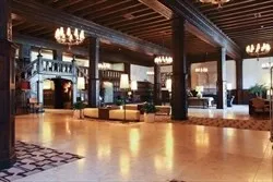 a view of a lobby with a couch and a chandelier
