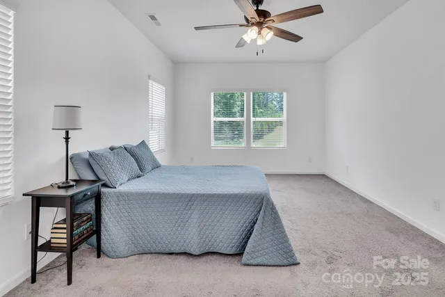 a bed room with a bed and a window