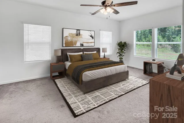 a bedroom with a large bed and a window