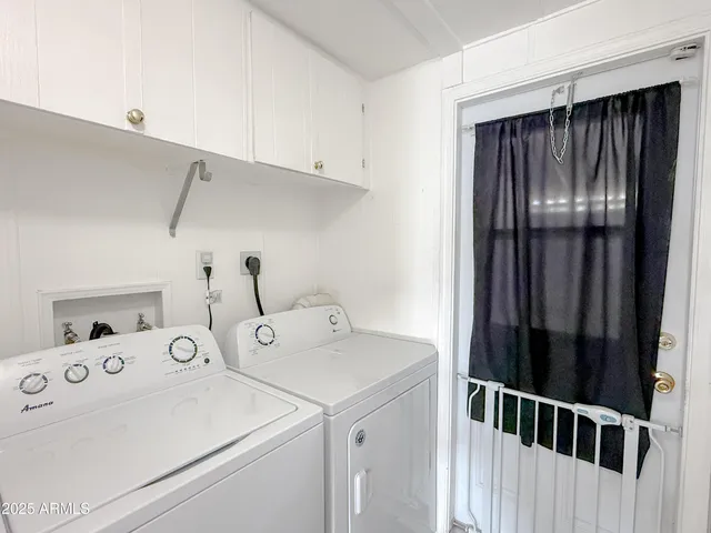 a spacious bathroom with a sink and a mirror