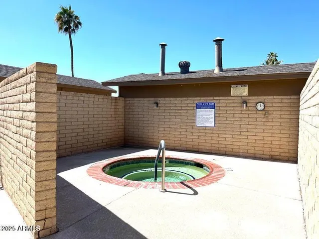 a front view of a house with a yard table and chairs