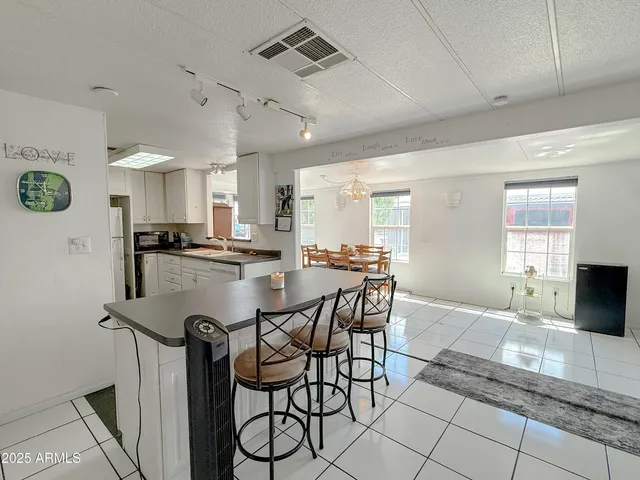 a kitchen with a refrigerator a stove top oven a sink and dishwasher