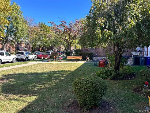 a view of street with parked cars