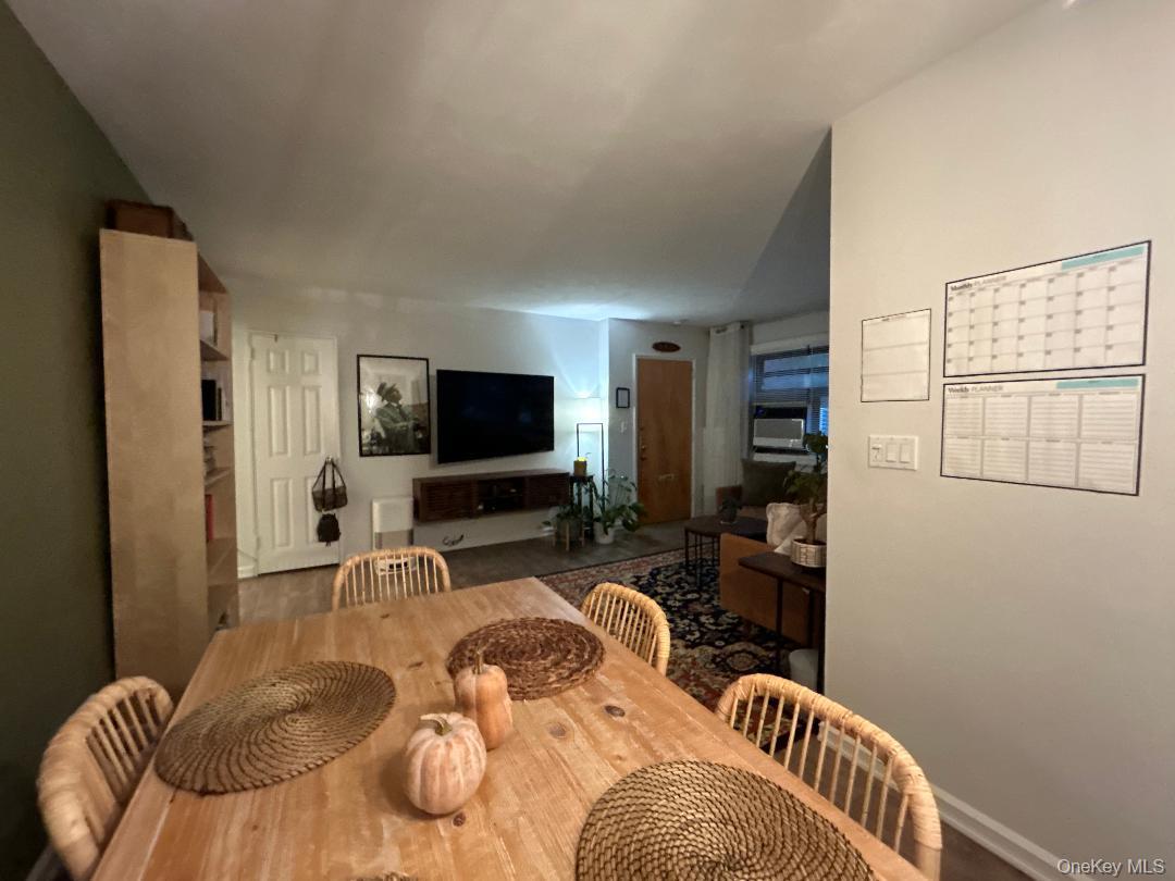 199-08 21st Avenue, Unit 1327 Queens, NY 11357 - Photo 6 of 21 a bedroom with furniture and a flat screen tv