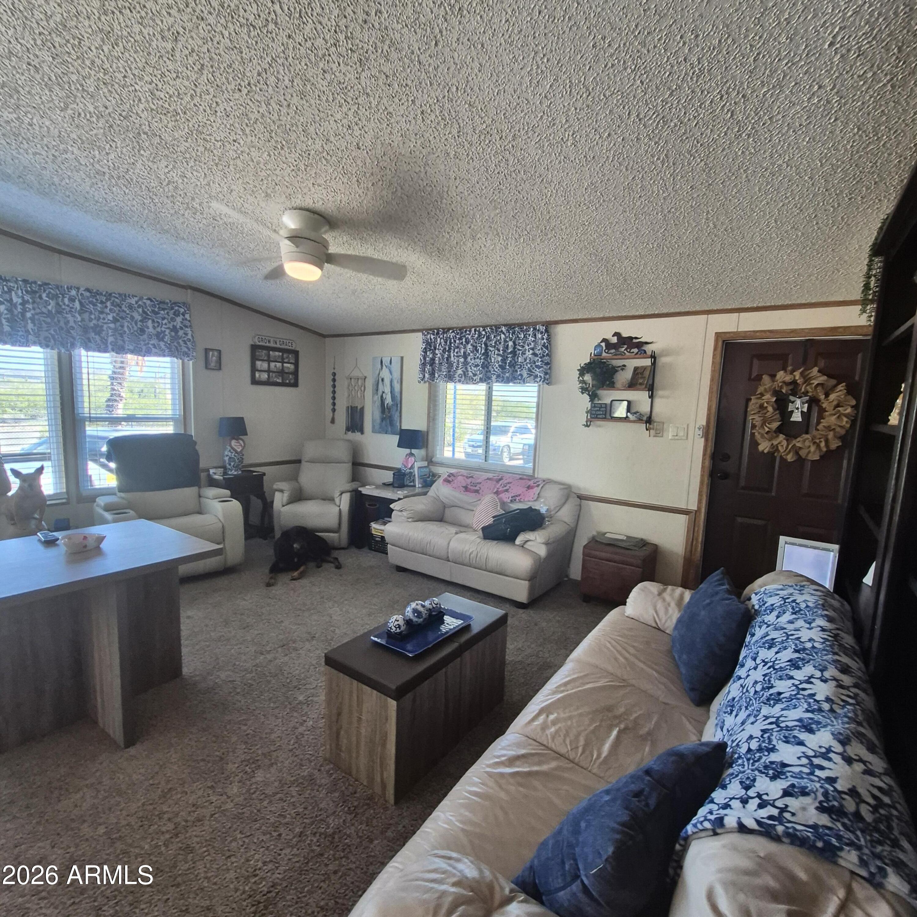 1980 South Hilton Road Apache Junction, AZ 85119 - Photo 13 of 42 a living room with furniture lamp and window