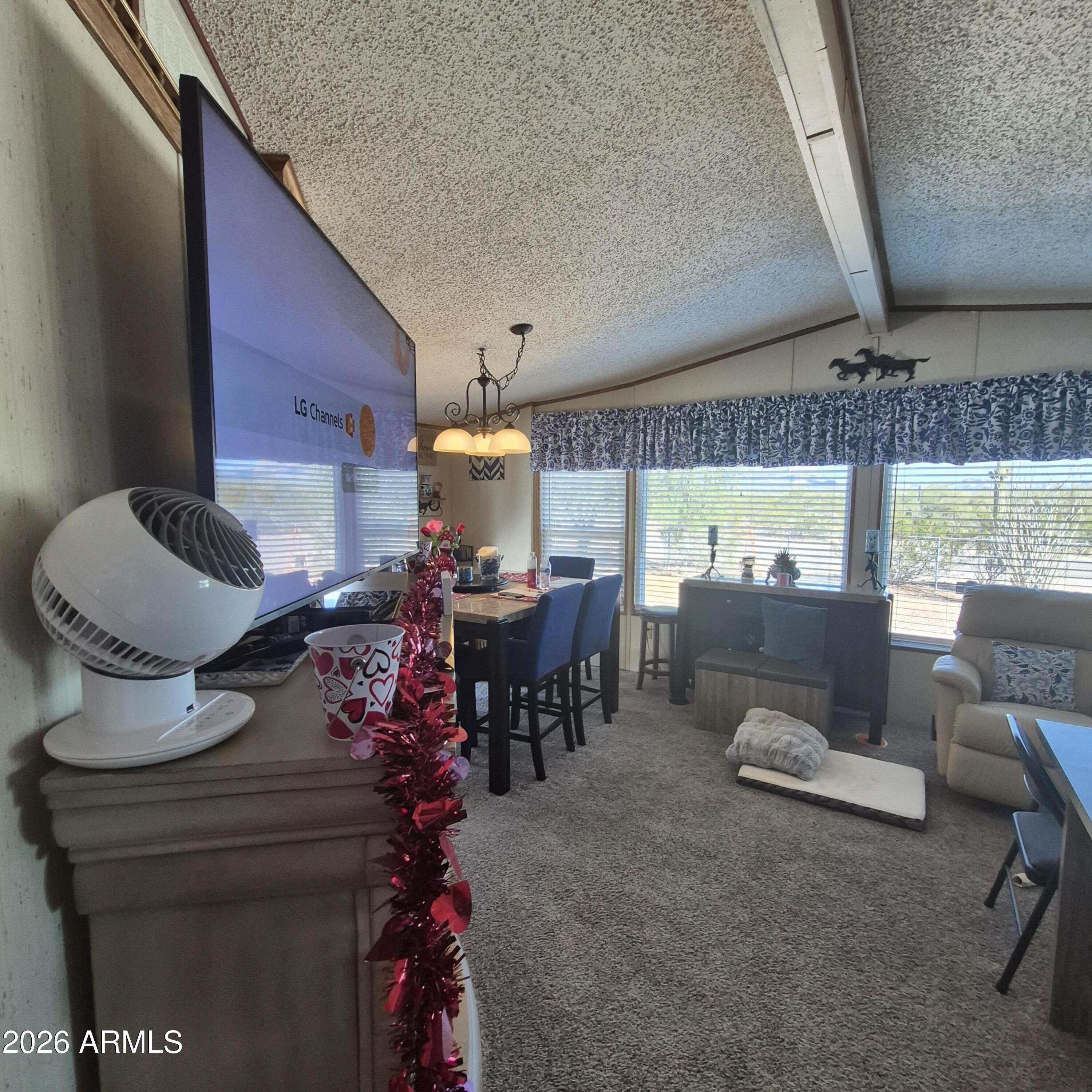 1980 South Hilton Road Apache Junction, AZ 85119 - Photo 14 of 42 a living room with furniture and a fireplace