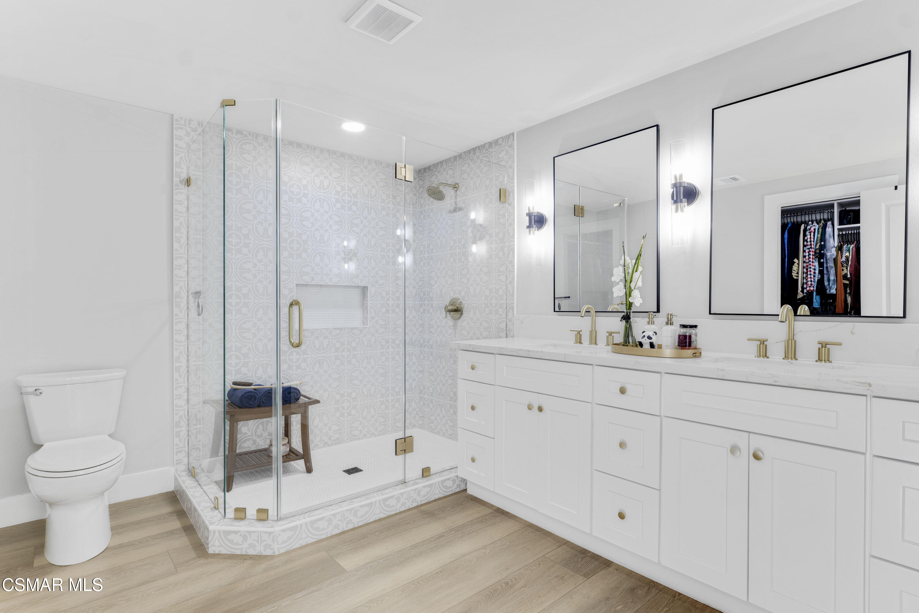 19120 Salt Lake Place Porter Ranch, CA 91326 - Photo 28 of 47 a bathroom with a double vanity sink mirror and toilet
