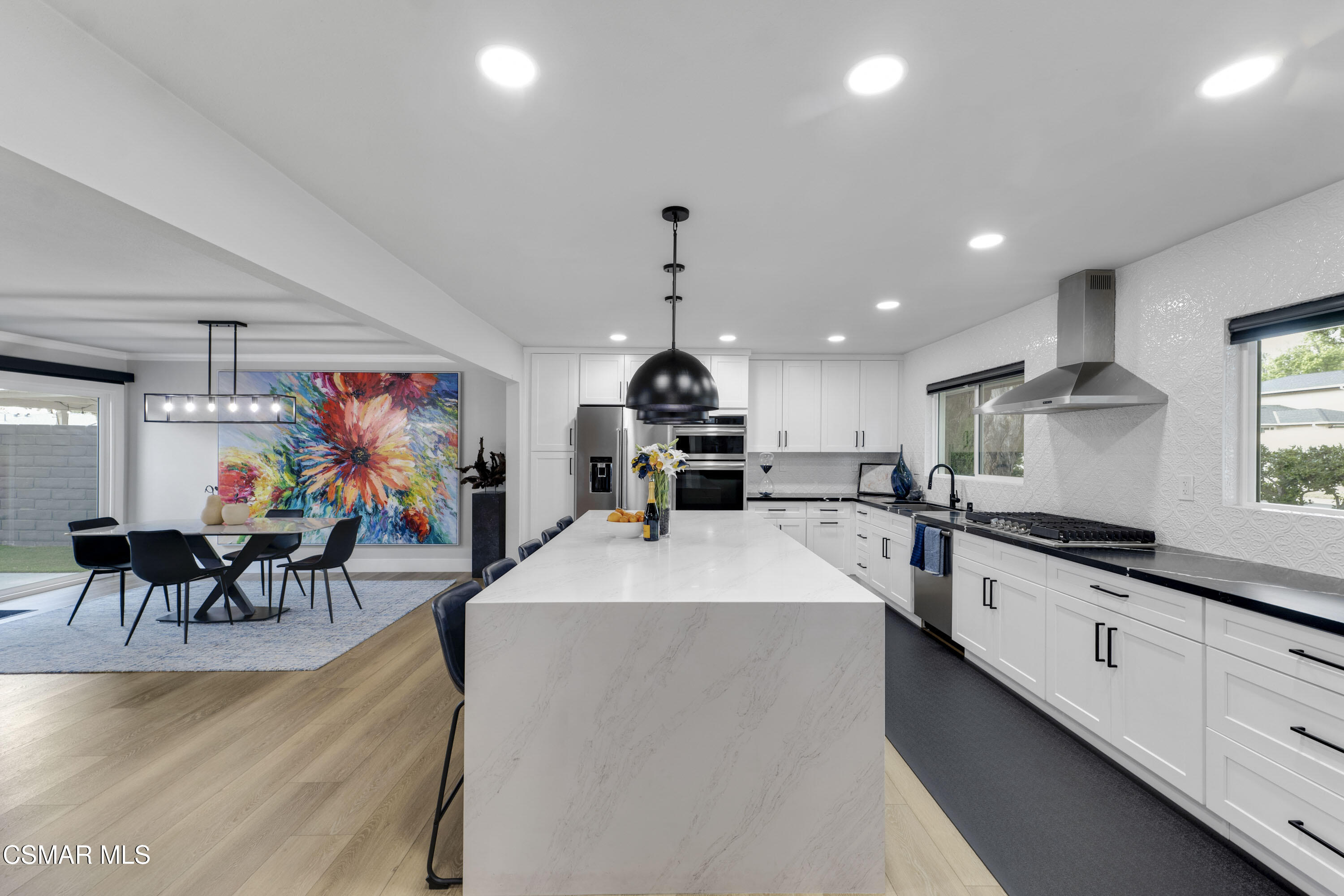 19120 Salt Lake Place Porter Ranch, CA 91326 - Photo 2 of 47 a large kitchen with granite countertop lots of counter top space