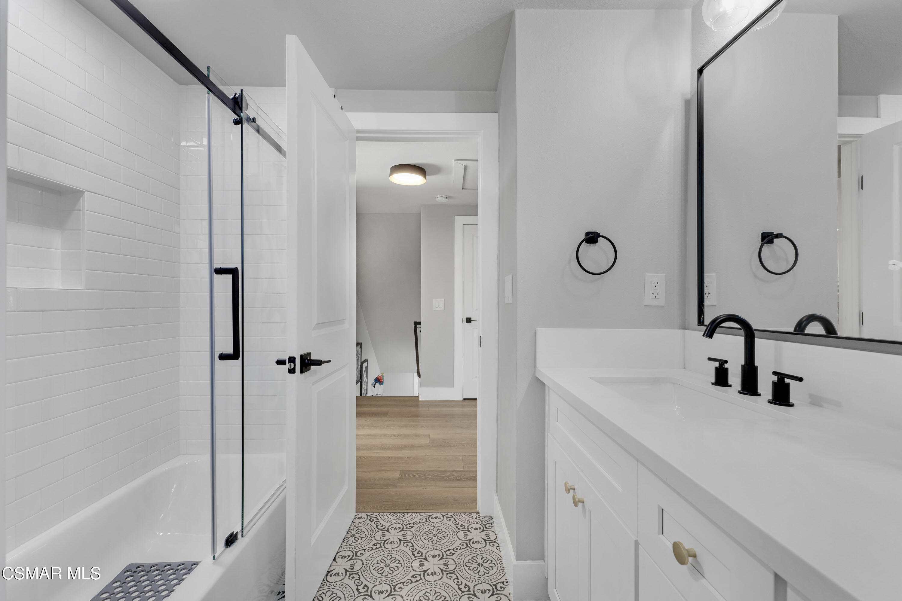 19120 Salt Lake Place Porter Ranch, CA 91326 - Photo 35 of 47 a bathroom with a double vanity sink mirror and shower