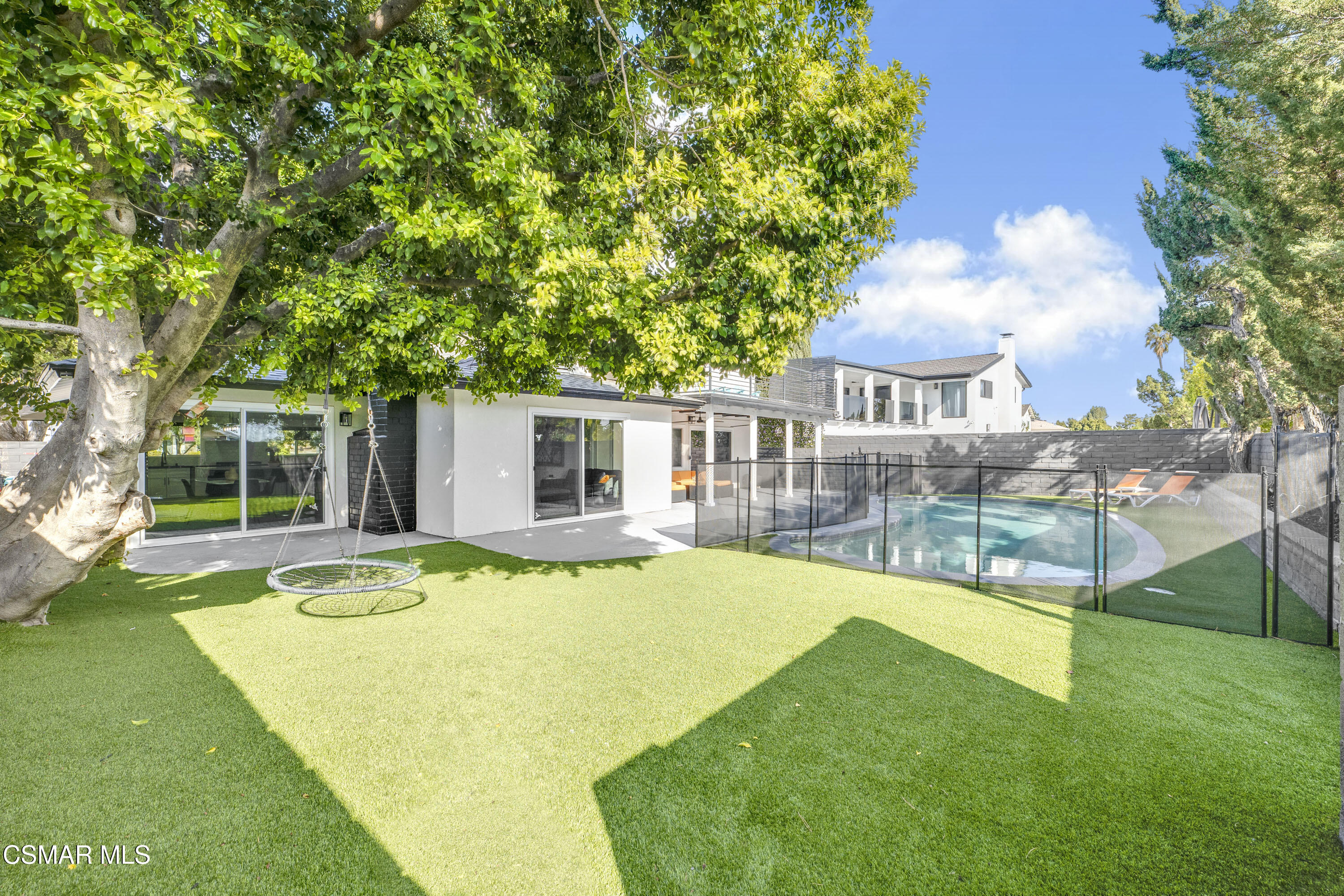 19120 Salt Lake Place Porter Ranch, CA 91326 - Photo 37 of 47 a view of a house with swimming pool and a yard