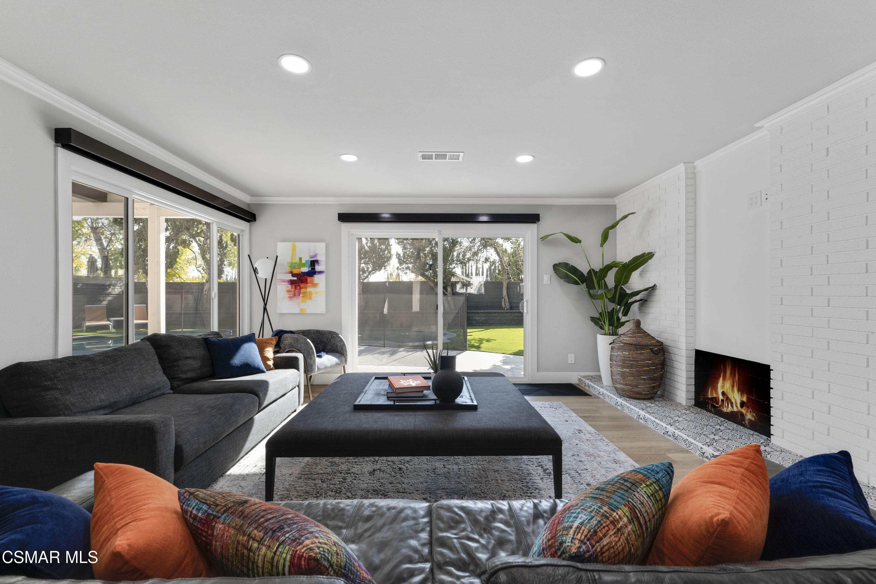 19120 Salt Lake Place Porter Ranch, CA 91326 - Photo 6 of 47 a living room with furniture and a fireplace