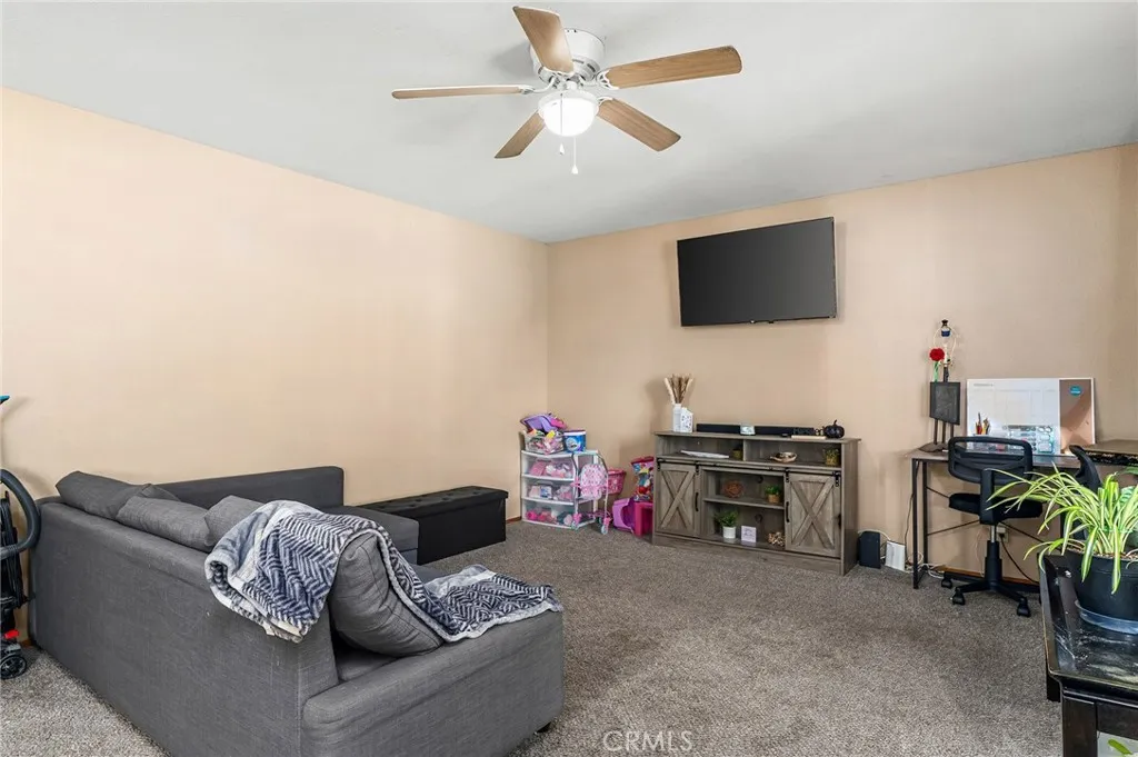 631 North Street, Unit 631 Corning, CA 96021 - Photo 12 of 39 a living room with furniture and a flat screen tv
