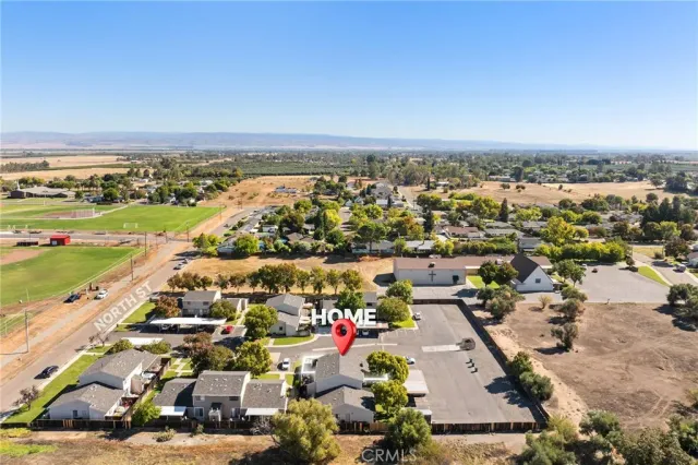 a view of a garden with lawn chairs