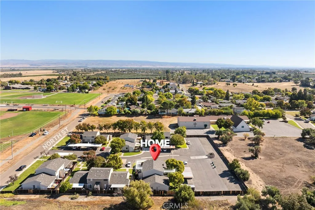 631 North Street, Unit 631 Corning, CA 96021 - Photo 24 of 39 an aerial view of residential building and lake